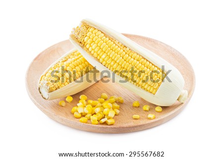 ear of corn and canned corn on Wood tray isolated on white background, selective focus (detailed close-up shot)