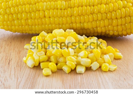 close up canned corn and sweet corn  on Wood tray isolated on white background, selective focus (detailed close-up shot)