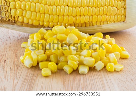 close up canned corn and sweet corn  on Wood tray isolated on white background, selective focus (detailed close-up shot)