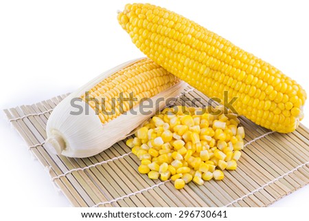 sweet corn, ear of corn and canned corn on Makisu background, selective focus (detailed close-up shot)