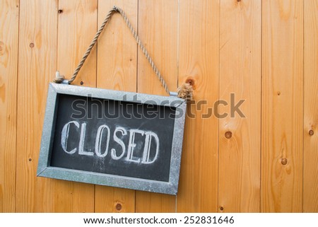 Close Sign On Wood Door