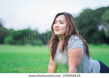 beautiful fatty woman relax in the garden