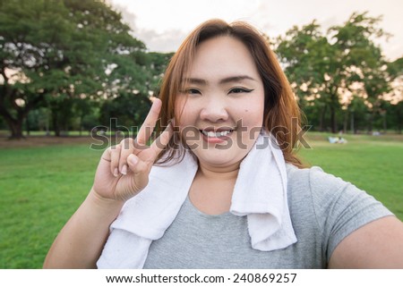 beautiful fatty woman take herself photo in the garden