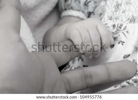 Father and son hands, black and white image