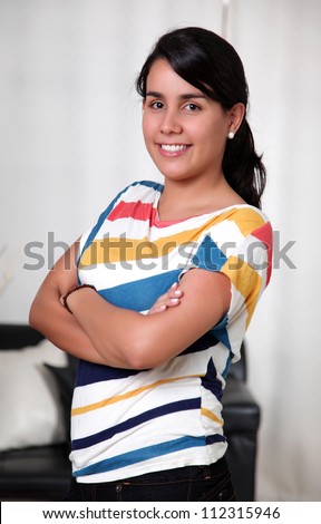 Smiling woman with hands folded and happy