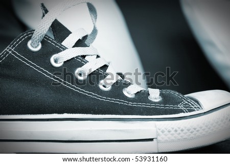 black and white gym shoe on a table