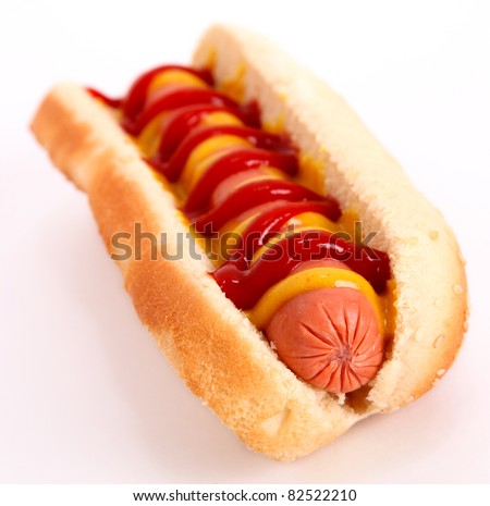 hot dog with sausage, mustard,ketchup and bread over white background