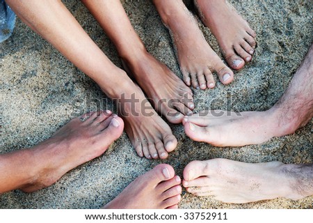 Friend feet on the sand