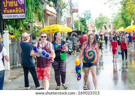 CHIANG MAI, THAILAND - APRIL 13, 2015: Tourists do not know the name playing water in Songkran festival on April 13, 2015 at Tha Pae Gate in Chiang mai