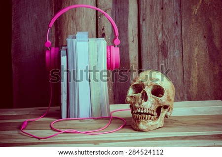 still life Headphones pink book skulls of modern educational concepts.