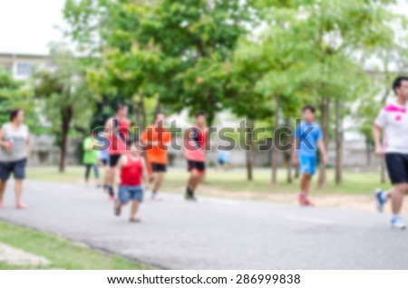 Blur people jogging in the stadium