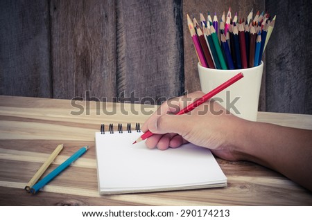 Hand drawing in open notebook on table