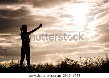 Shadow of a girl showing signs glad to see the sun, sky, nature