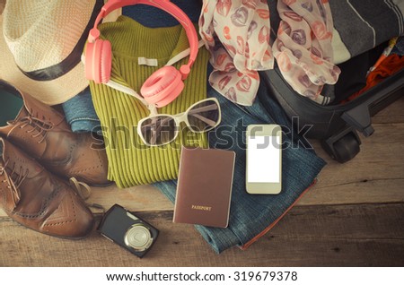 Travel accessories, clothes Wallet, glasses, phone headset. Passport, shoes. Ready for travel