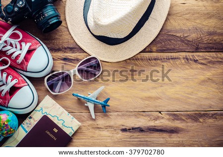 Travel accessories and costume on wooden floor