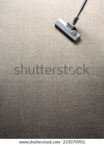 Vacuum cleaner on a carpet with copy space