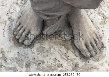 Marble sculpture depicting Jesus\' feet.