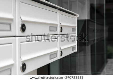 Mailboxes, with a modern design, positioned at the entrance of an apartment building.