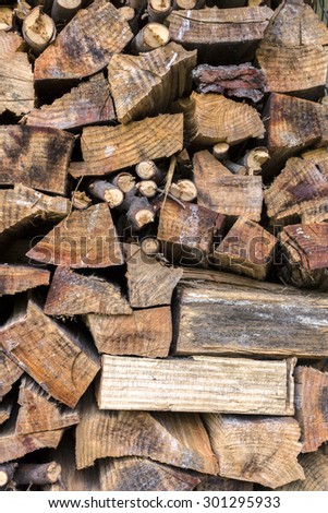 Lumber of various sizes stacked as a spare for the winter.