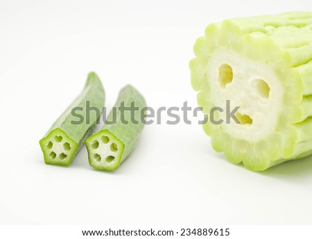 Fresh rosella and bitter gourd with emotional face for cooking on white background