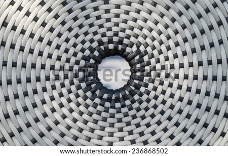Close up of weaved plastic in black and white color with round shape for texture background