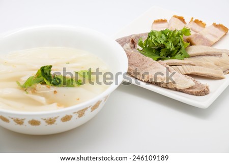 Local noodle Thai soup with boiled pork meat for delicious meal on white background