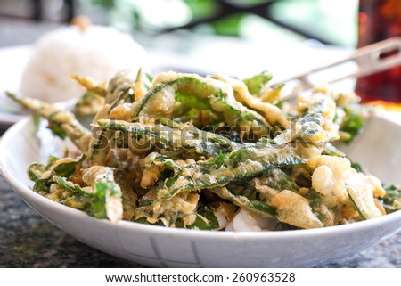 Close up hot and spicy fried vegetable with seafood and jasmine rice for food background