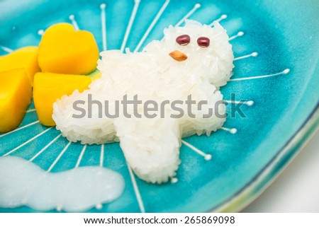 Soft focused of sticky rice with sweet mango on blue ceramic plate for popular Thai local dessert background