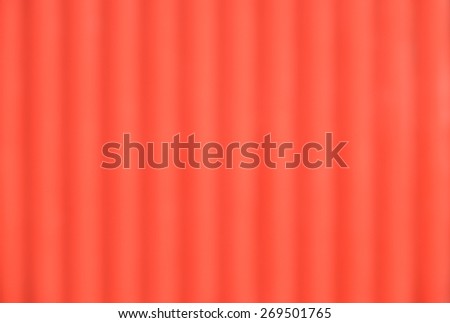 De focused or blurred bright red orange with vertical lines for plain background