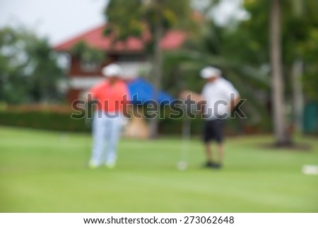 De focused or blurred men talking during golf game for background