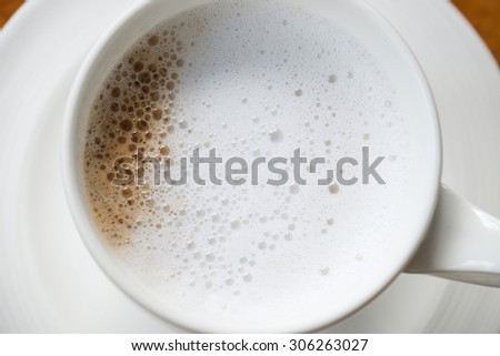 Top view of freshly brewed espresso with cream milk or cappuccino for breakfast