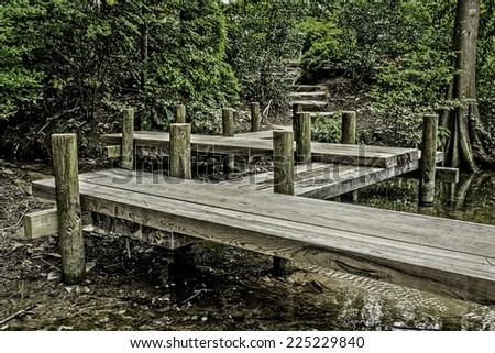Pier in the woods leading to a path