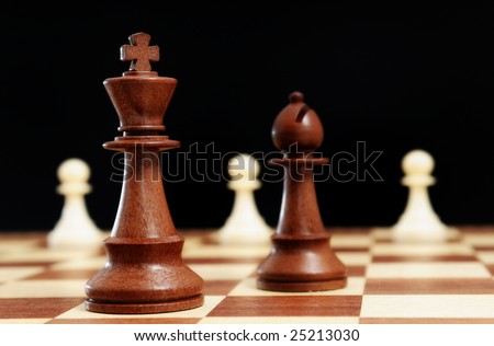 Chess - Black King, black bishop and white pawns on black background