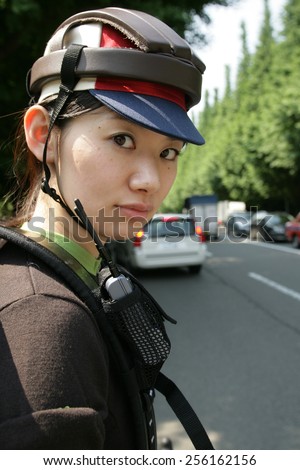 Portrait of a young woman wearing a cycling helmet