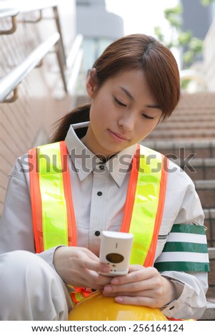 Close up of a female traffic cop using a mobile phone