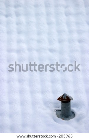 Snow covered roof with a small chimney (vertical shot)
