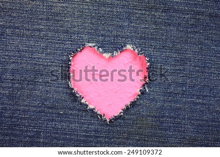 Red heart  of   torn denim jeans background :Valentine Heart Card Design
