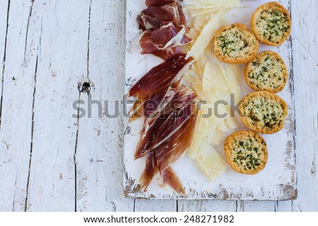Traditional spanish tapas. Appetizer with spanish Ham and Cheese.Natural food concept.