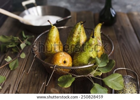 Fruit background. Still life with  Fresh organic pears on old wood. Pear autumn harvest. Retro vintage style. Top view. See series. Partial Blurred background