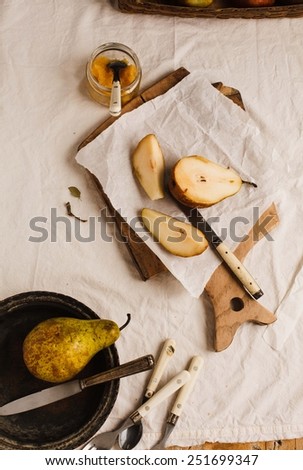 Vintage style with pears on a rustic table. Food background. Fresh ingredients on a wooden table .