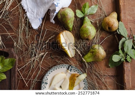 Fresh organic fruits. Natural pears with leaves onto a vintage wooden background. Natural fruit concept. Ecology concept. Fruit background. Healthy food from garden. Rustic style