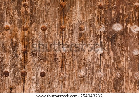 Tonic vintage background. Part of the old door at medieval house. Vintage wood grey  background with metal ornament. Decorative metal background. Vintage style. See series