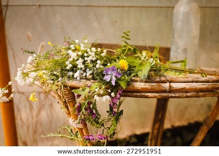 Beautiful Spring flowers over on rustic table.