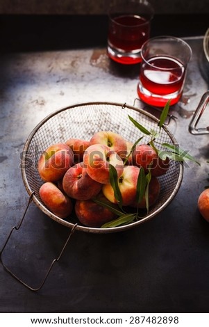 Fresh nectarines (peach) and fresh wine ready to prepare sangria drink. Rustic style.
