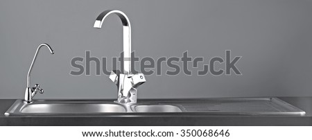 Faucet and water purifier for bathroom or kitchen on gray background