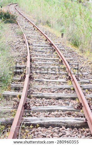 Old abandoned rail tracks, concept of what\'s around the corner