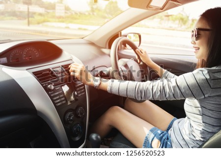 beauty Young asia woman with sunglass happy smile driver sitting in the car