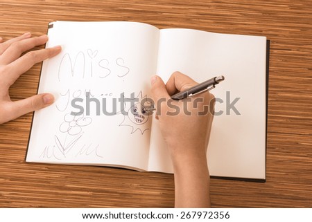 writing, hand, book, notebook, accounting, desk, account, pen, open, organizer, woman, businesswoman, paper, closeup, page, table, pad, white, sitting, business, study, diary