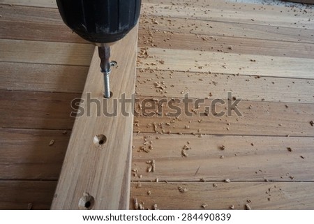 use screw machine for insert screw into the wood