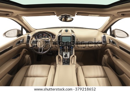 Car interior luxury. Interior of prestige modern car. Leather comfortable seats, dashboard & steering wheel. Beige cockpit with exclusive wood & metal decoration on isolated white background.